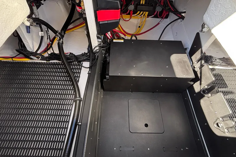 Slide: The Image of Interior view of 2026 Monterey Elite 30 OB boat's engine compartment with wiring. - 17