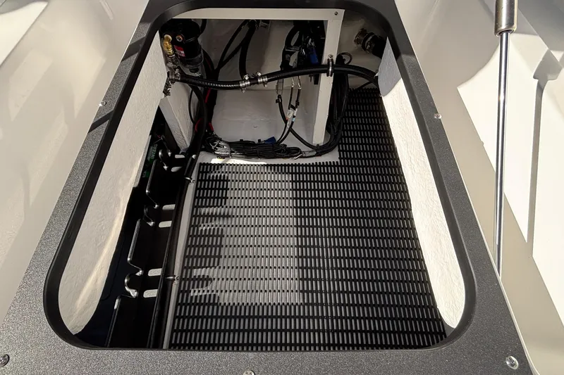 Slide: The Image of Open storage compartment of 2026 Monterey Elite 30 OB boat, showcasing interior details. - 19