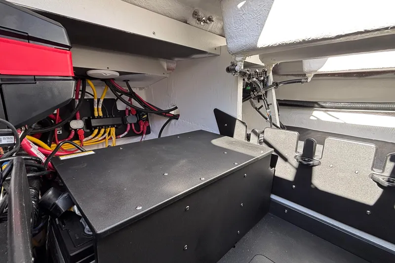 Slide: The Image of 2026 Monterey Elite 30 OB engine compartment with wiring and components. - 22