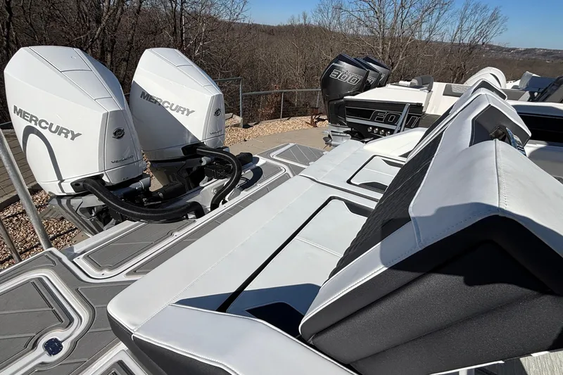 Slide: The Image of 2026 Monterey Elite 30 OB boat with dual Mercury outboard engines, sleek seating, and modern design. - 23