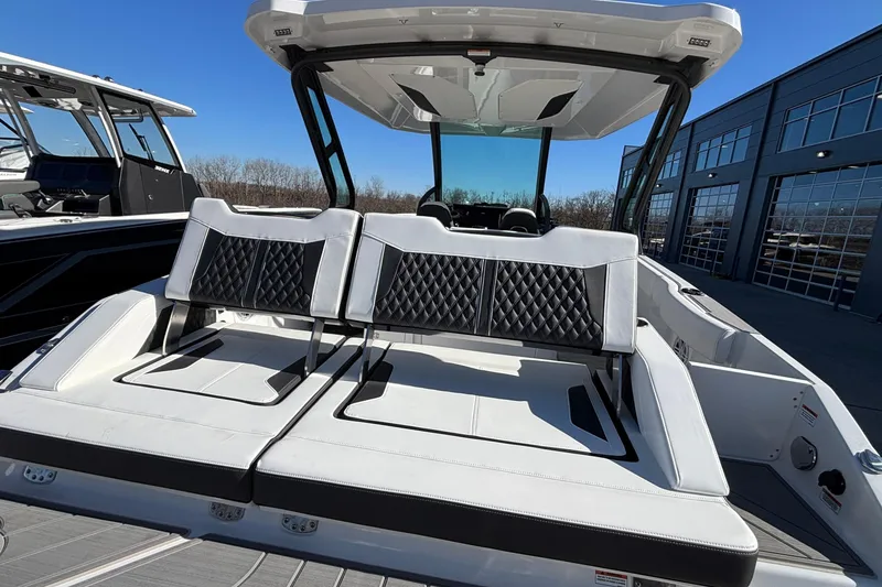 Slide: The Image of 2026 Monterey Elite 30 OB boat with luxurious seating and modern design. - 24