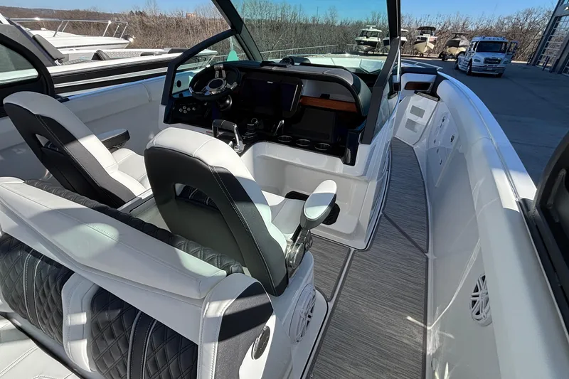 Slide: The Image of 2026 Monterey Elite 30 OB boat interior with modern helm and luxurious seating. - 25