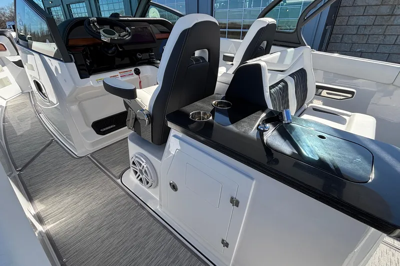 Slide: The Image of 2026 Monterey Elite 30 OB boat interior with modern helm and seating. - 30
