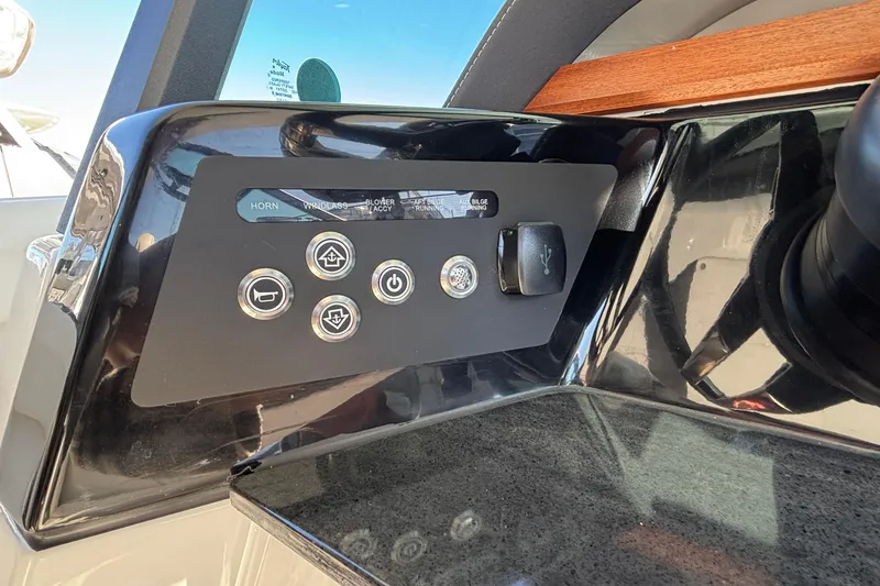 Slide: The Image of Control panel of 2026 Monterey Elite 30 OB boat with various function buttons. - 36
