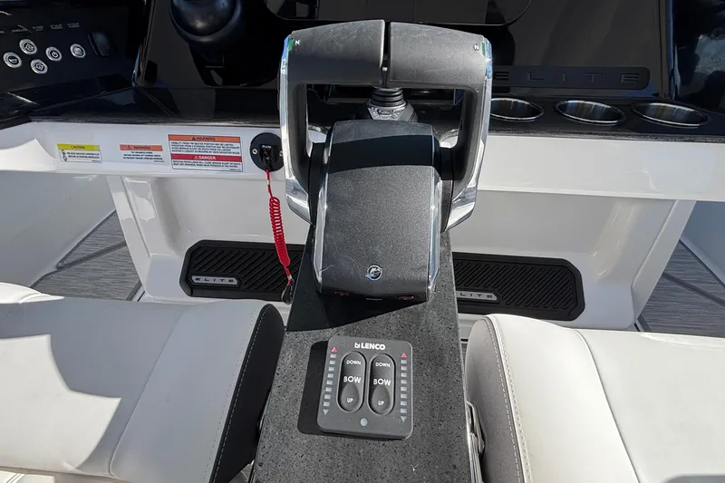 Slide: The Image of Control panel of 2026 Monterey Elite 30 OB boat with throttle and trim controls. - 39