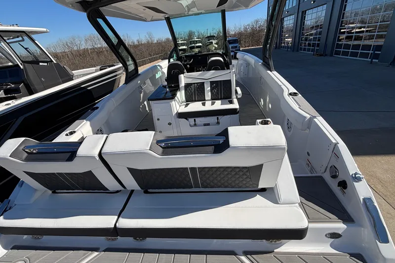 Slide: The Image of 2026 Monterey Elite 30 OB boat interior with luxurious seating and modern design. - 4
