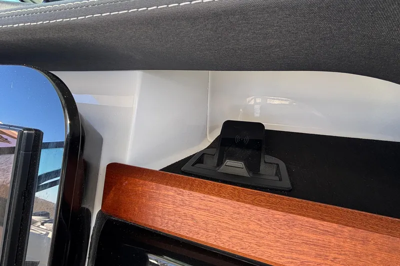 Slide: The Image of 2026 Monterey Elite 30 OB interior detail with wireless charging pad and wood trim. - 40