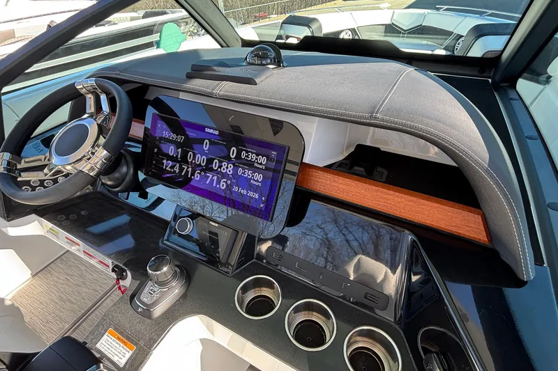 Slide: The Image of Dashboard of 2026 Monterey Elite 30 OB boat with modern controls and display. - 41