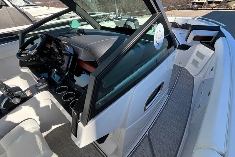 Slide: The Image of 2026 Monterey Elite 30 OB boat interior with modern dashboard and seating. - 42