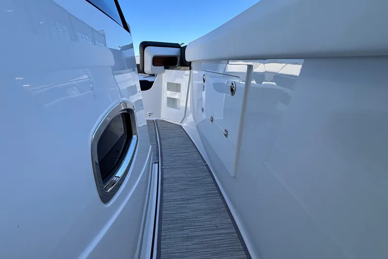 Slide: The Image of 2026 Monterey Elite 30 OB boat deck with sleek design and storage compartments. - 43
