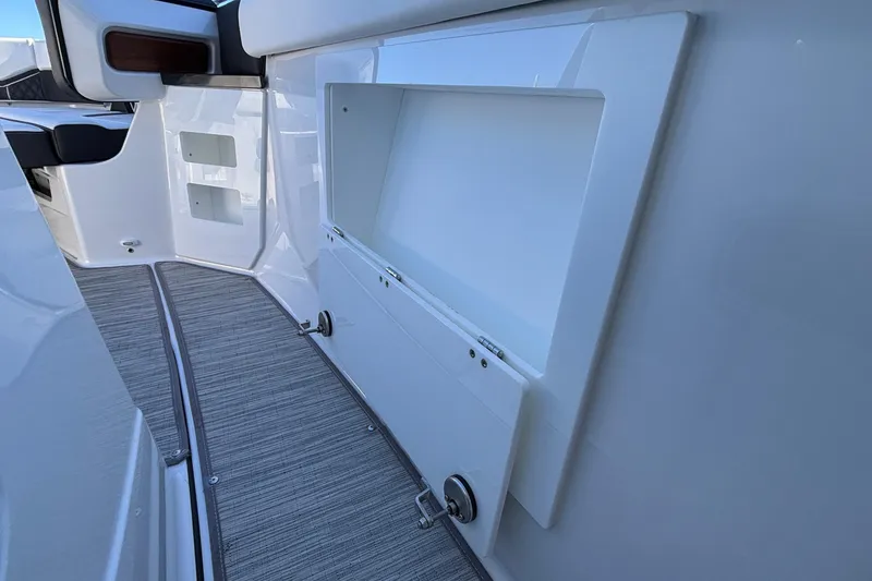 Slide: The Image of 2026 Monterey Elite 30 OB boat interior storage compartment with sleek design and modern features. - 44