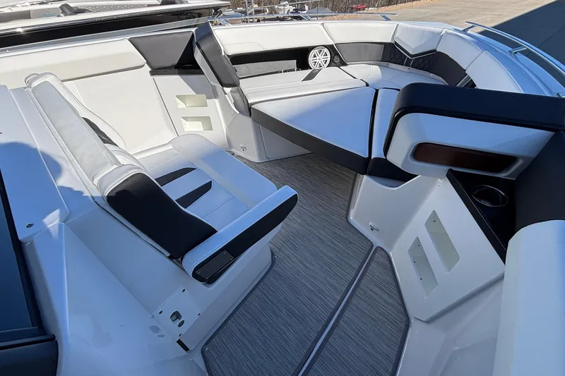 Slide: The Image of 2026 Monterey Elite 30 OB boat interior with sleek seating and modern design. - 45