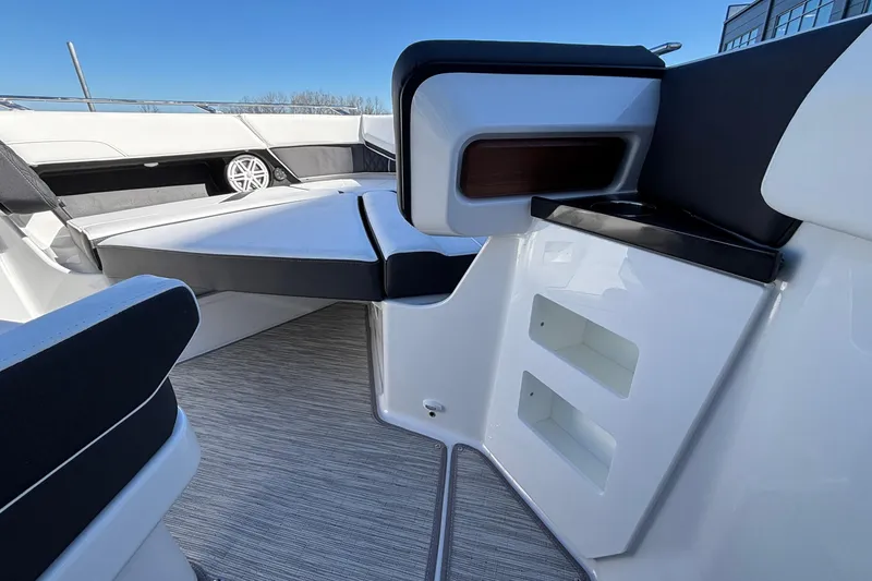 Slide: The Image of 2026 Monterey Elite 30 OB boat interior with sleek seating and modern design. - 46