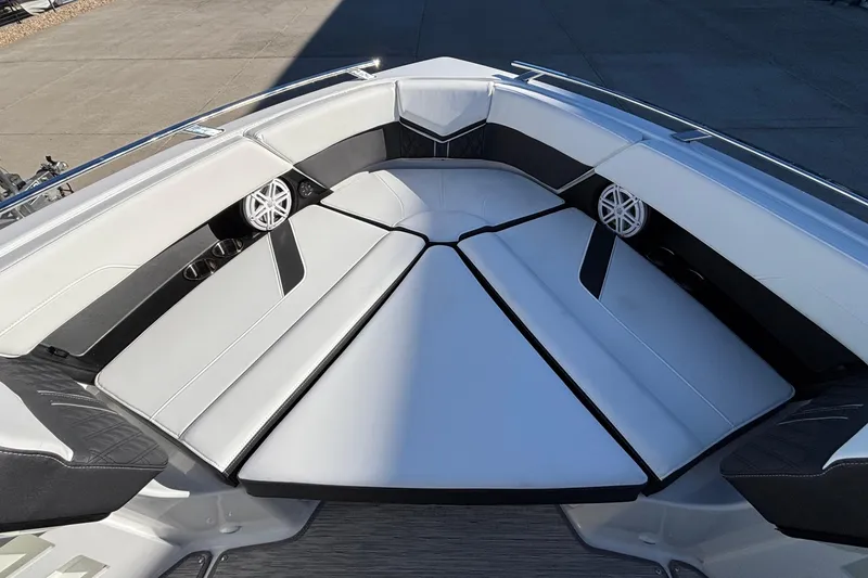 Slide: The Image of 2026 Monterey Elite 30 OB boat interior with cushioned seating and built-in speakers. - 47