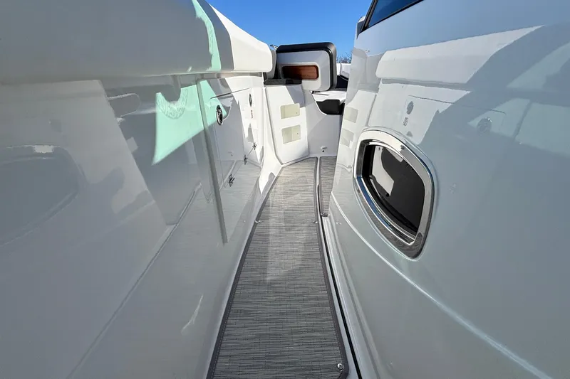 Slide: The Image of 2026 Monterey Elite 30 OB boat interior walkway with sleek design and modern features. - 50