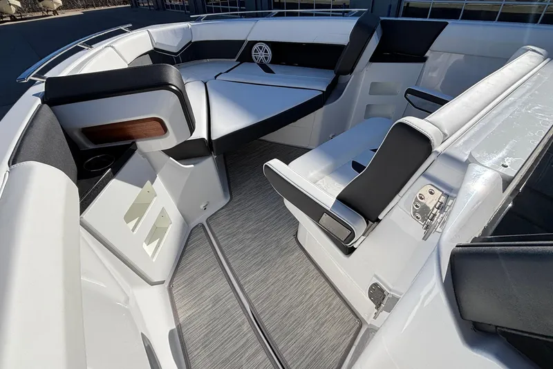 Slide: The Image of 2026 Monterey Elite 30 OB boat interior with sleek seating and modern design. - 52