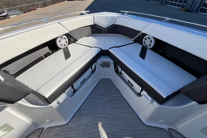 Slide: The Image of Luxurious seating area on 2026 Monterey Elite 30 OB boat, featuring sleek design and modern speakers. - 53