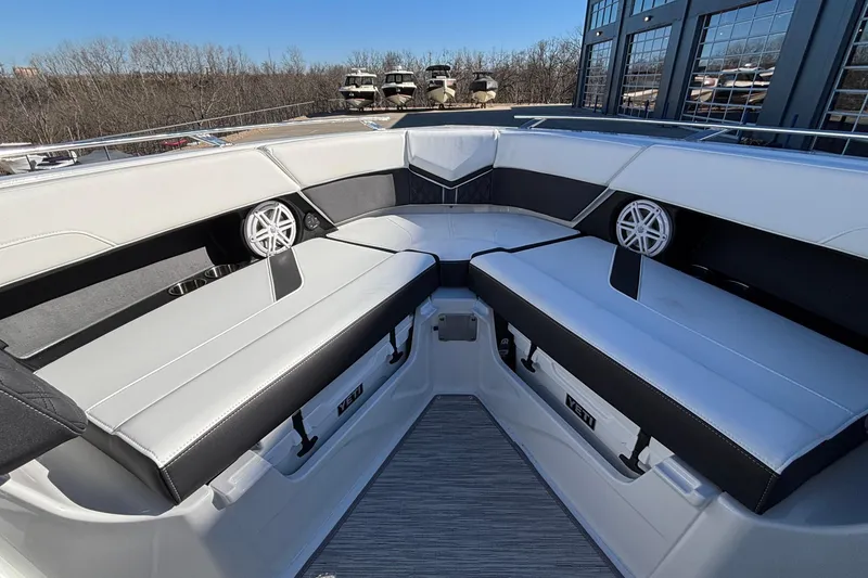 Slide: The Image of 2026 Monterey Elite 30 OB boat interior with sleek seating and modern design. - 54