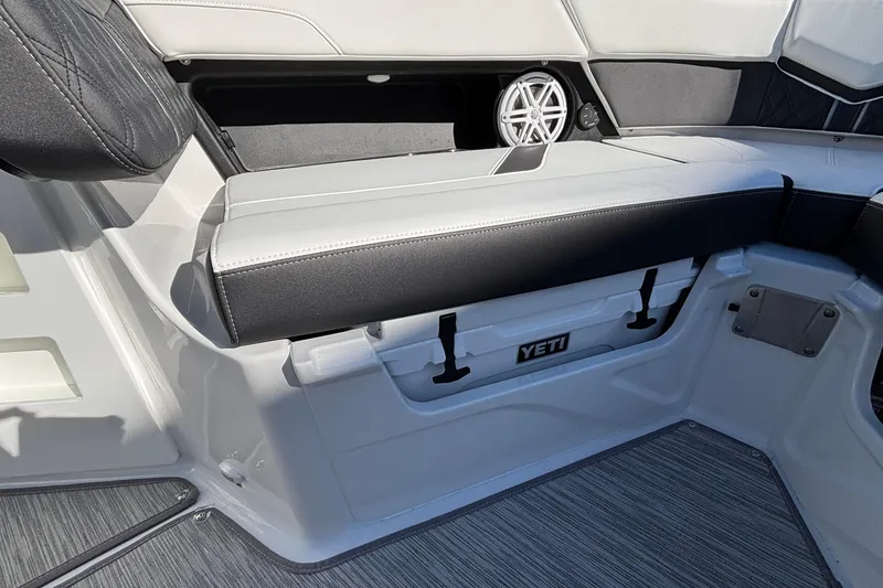 Slide: The Image of 2026 Monterey Elite 30 OB boat interior with Yeti cooler storage. - 55