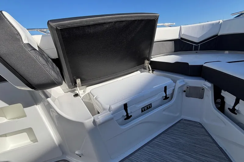 Slide: The Image of 2026 Monterey Elite 30 OB boat interior with Yeti cooler storage. - 57