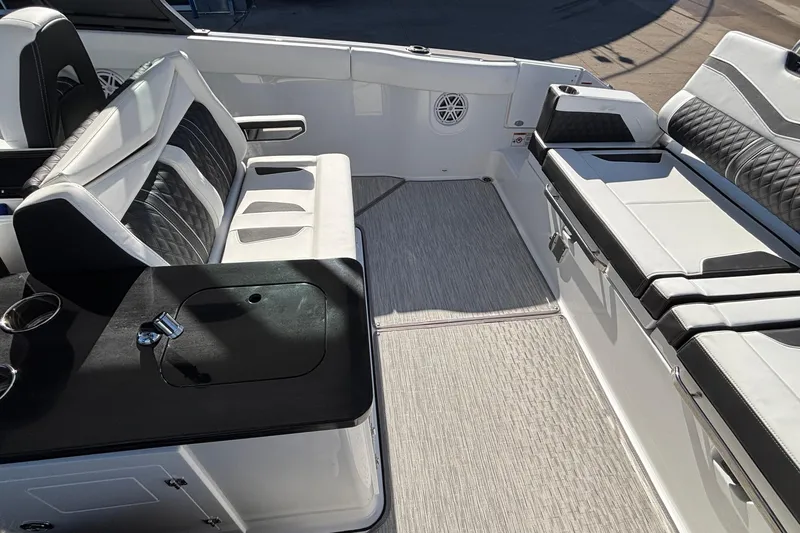 Slide: The Image of 2026 Monterey Elite 30 OB boat interior with luxurious seating and sleek design. - 6