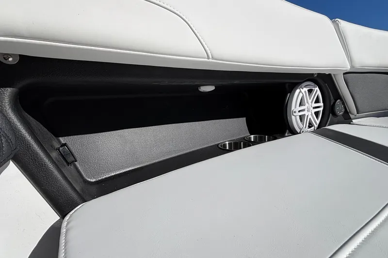 Slide: The Image of 2026 Monterey Elite 30 OB boat interior with speaker and cup holders. - 60