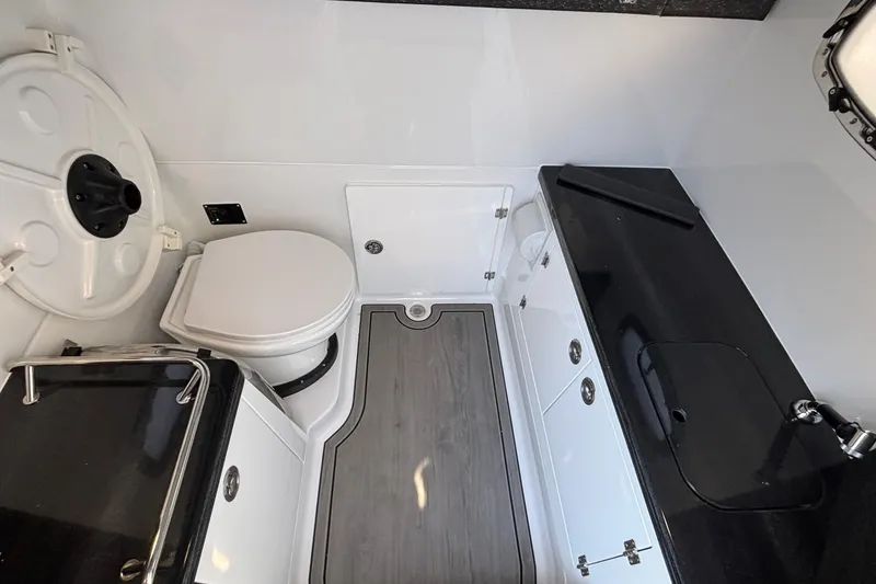 Slide: The Image of Luxurious bathroom interior of 2026 Monterey Elite 30 OB boat, featuring modern fixtures and sleek design. - 63