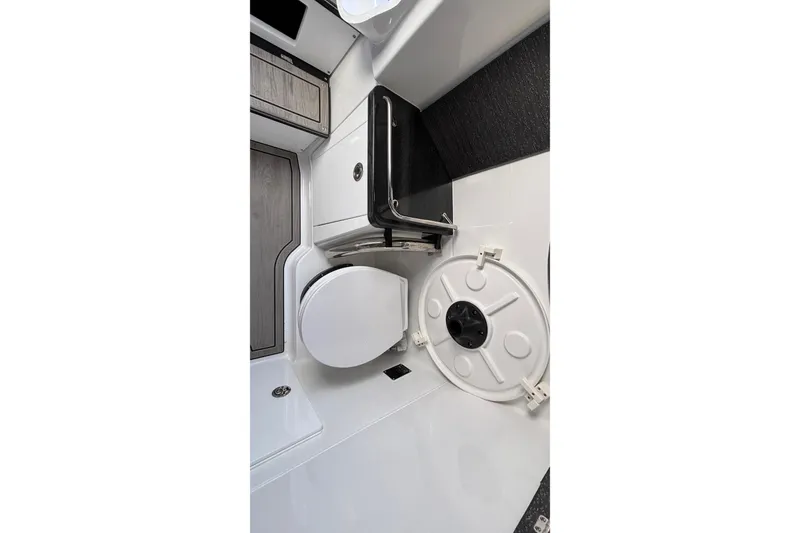 Slide: The Image of 2026 Monterey Elite 30 OB boat interior with modern bathroom amenities. - 64