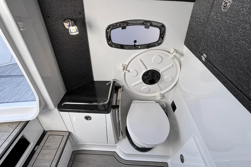 Slide: The Image of 2026 Monterey Elite 30 OB boat interior with modern bathroom amenities. - 65