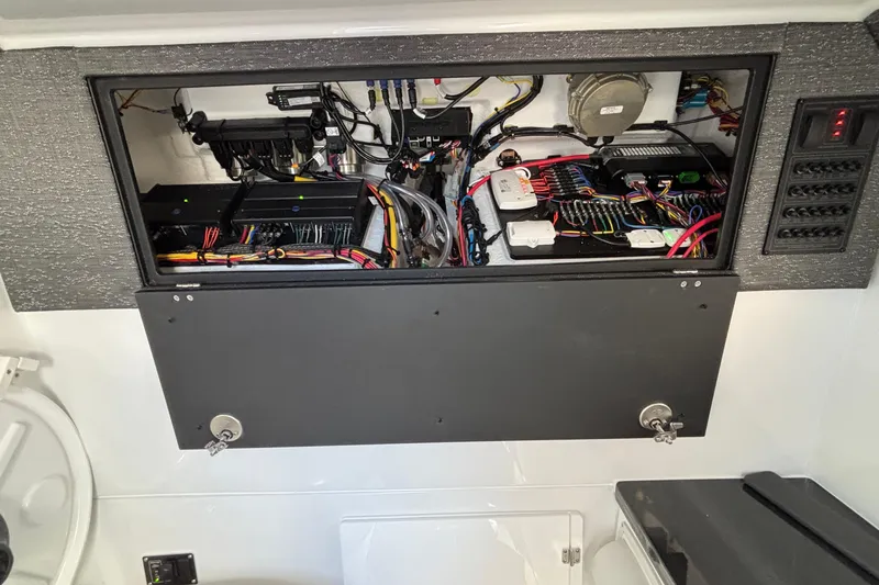 Slide: The Image of Electrical panel of 2026 Monterey Elite 30 OB boat, showcasing wiring and components. - 73