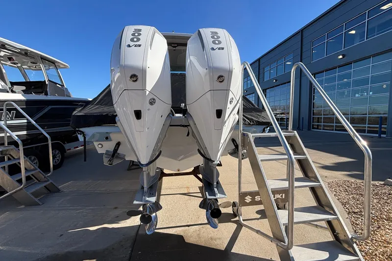 Slide: The Image of 2026 Monterey Elite 30 OB boat with dual 300 V8 engines, displayed outdoors. - 76