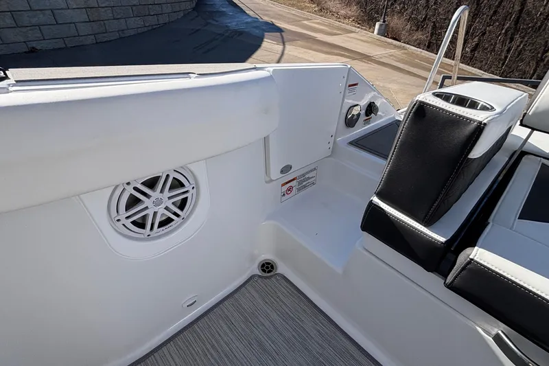 Slide: The Image of 2026 Monterey Elite 30 OB boat interior with speaker and seating area. - 8