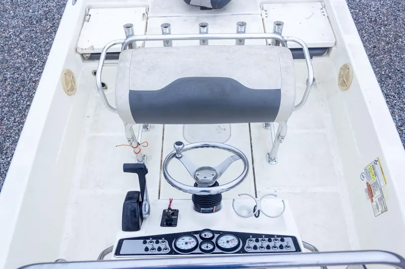 Slide: The Image of 2013 Skeeter SX210 boat cockpit with steering wheel and control panel. - 20