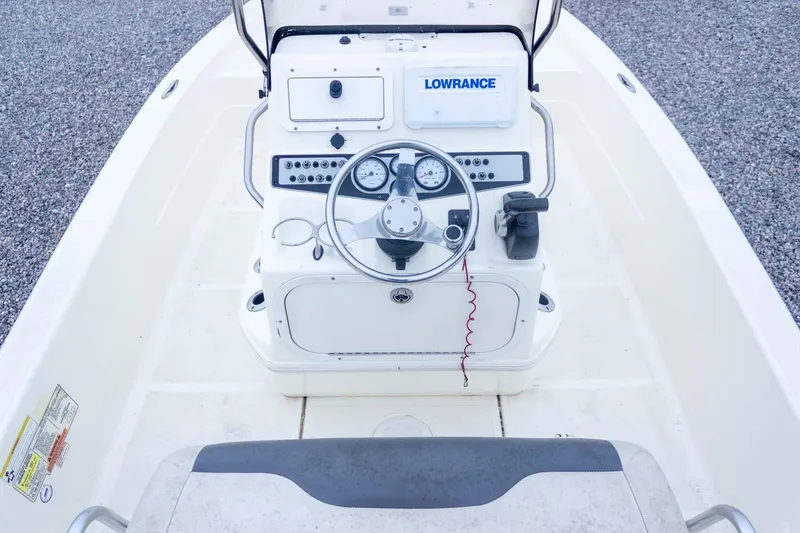Slide: The Image of 2013 Skeeter SX210 boat console with steering wheel and Lowrance navigation system. - 21