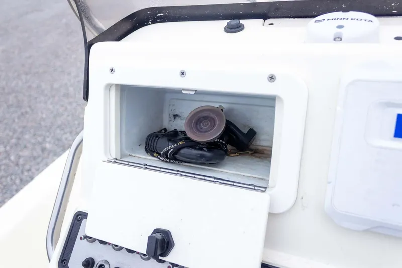 Slide: The Image of Storage compartment on a 2013 Skeeter SX210 boat with Minn Kota accessories. - 29