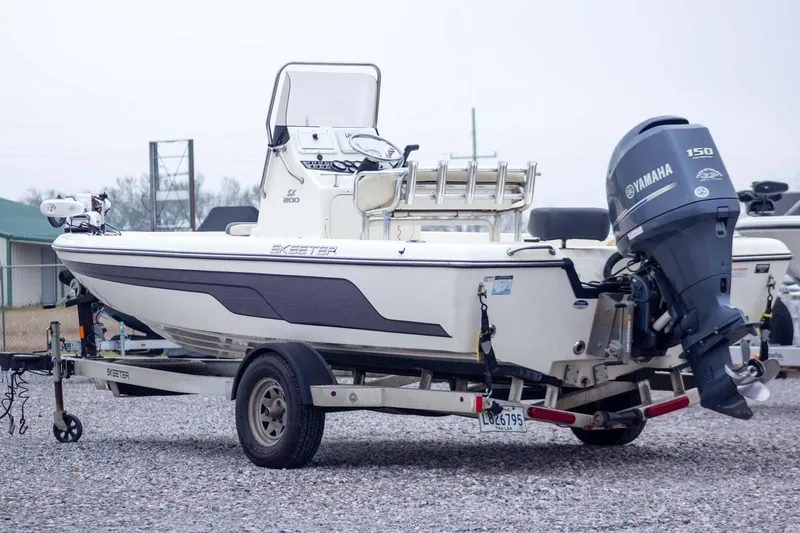 Slide: The Image of 2013 Skeeter SX210 boat on trailer with Yamaha 150 outboard motor. - 3