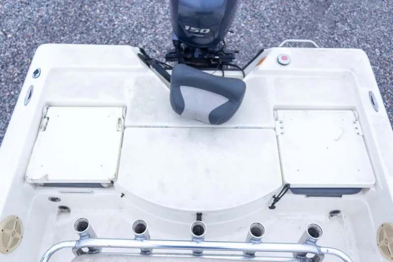 Slide: The Image of 2013 Skeeter SX210 boat deck with motor and rod holders. - 30