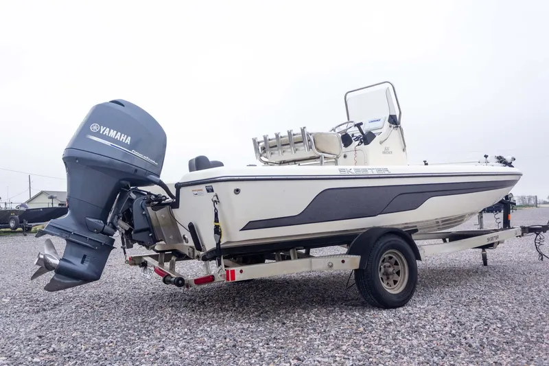 Slide: The Image of 2013 Skeeter SX210 boat with Yamaha outboard motor on a trailer. - 7