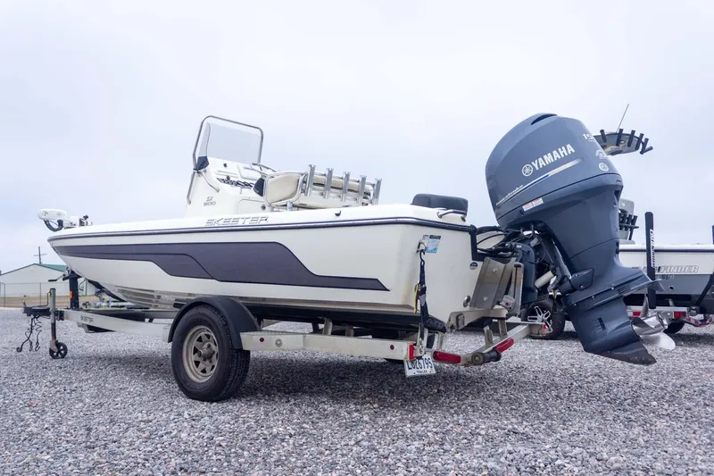 Slide: The Image of 2013 Skeeter SX210 boat with Yamaha outboard motor on a trailer. - 9