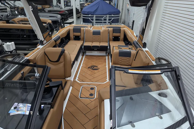 Slide: The Image of 2026 Malibu Wakesetter 26 LSV interior with luxurious tan seating and modern design. - 11