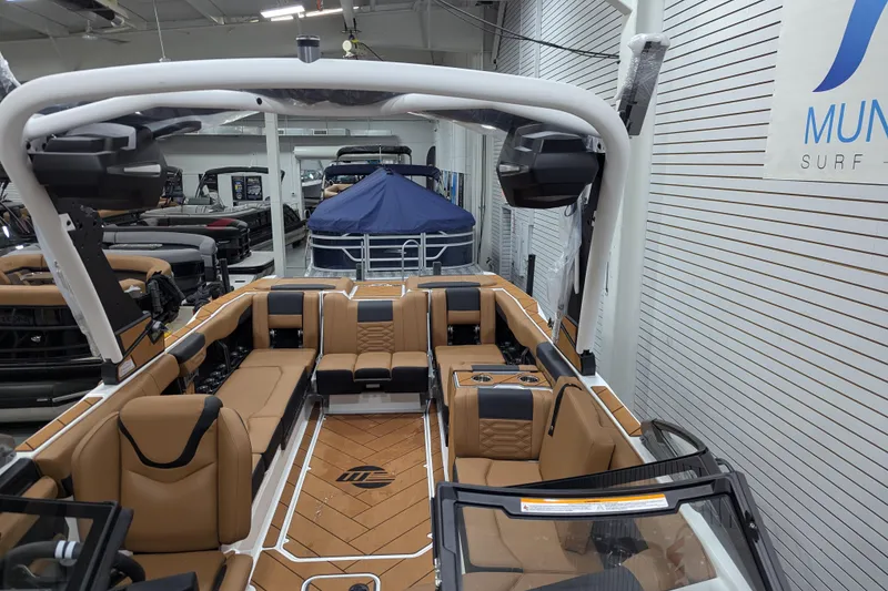 Slide: The Image of 2026 Malibu Wakesetter 26 LSV interior with tan seating and modern design. - 12