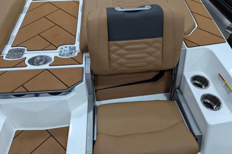 Slide: The Image of 2026 Malibu Wakesetter 26 LSV interior with tan seating and cup holders. - 15