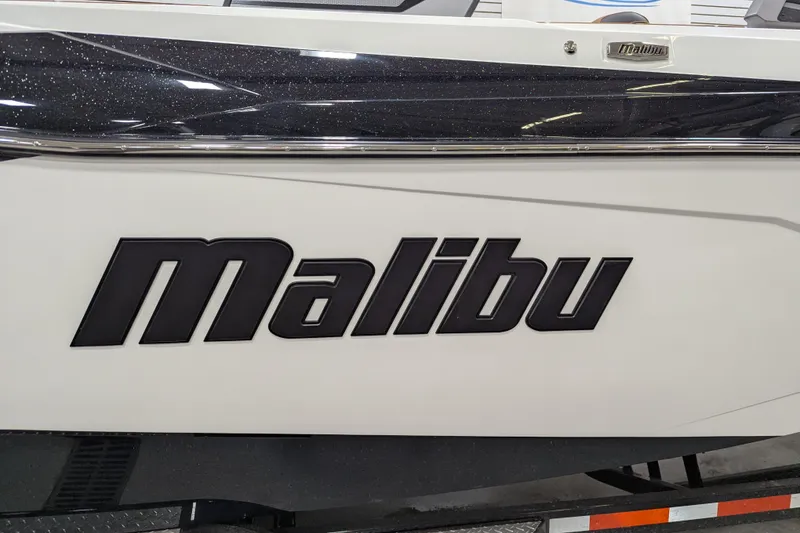 Slide: The Image of 2026 Malibu Wakesetter 26 LSV boat side view with logo. - 4