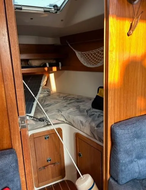 Slide: The Image of Interior of a 1998 Catalina 320 yacht with cozy cabin. - 24
