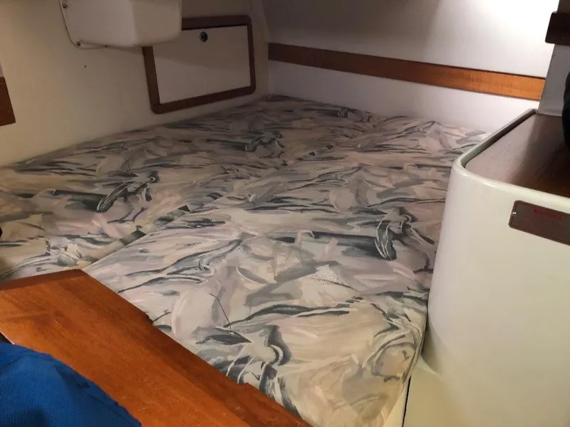 Slide: The Image of Interior of a 1998 Catalina 320 with patterned cushions. - 29