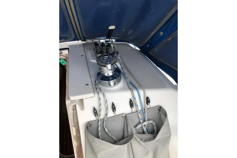 Slide: The Image of Cockpit of 1998 Catalina 320 sailboat with winch and ropes. - 32