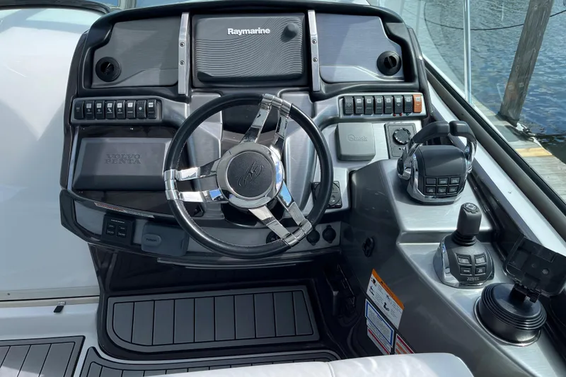 Slide: The Image of Cockpit of 2015 Monterey 415 Sport Yacht with steering wheel and control panel. - 11
