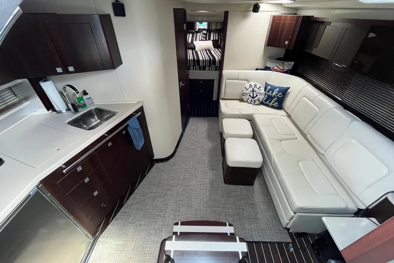 Slide: The Image of Luxurious interior of 2015 Monterey 415 Sport Yacht with modern kitchen and cozy seating. - 18