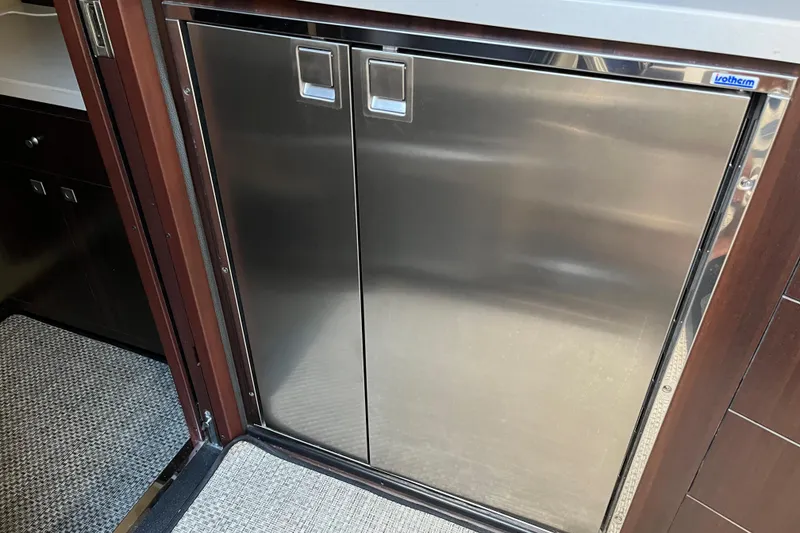 Slide: The Image of Stainless steel refrigerator in 2015 Monterey 415 Sport Yacht interior. - 22