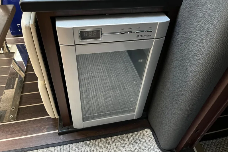 Slide: The Image of Compact Dometic fridge in 2015 Monterey 415 Sport Yacht interior. - 23